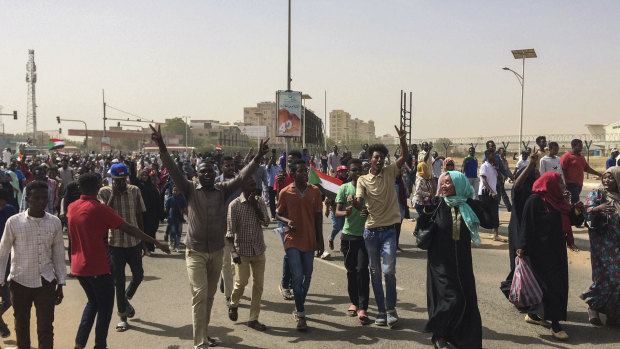 Sudanese celebrate after officials said the military had forced longtime autocratic President Omar al-Bashir to step down after 30 years in power.