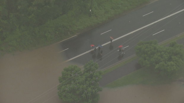 Flood waters from the Nepean river overtake the road.