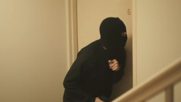 Jett McKee plays a home invader in the video clip for Roger Rogerson three years before his death.