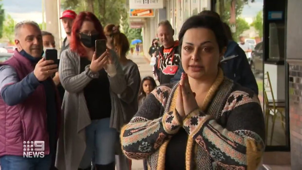 Jomana Najem speaking outside her Hughesdale salon on Saturday.