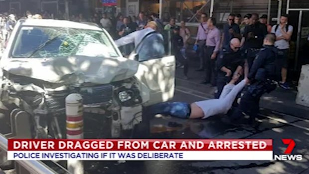 Police drag Saeed Noori from his car after the Flinders Street incident in December 2017.