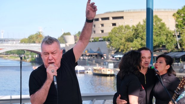 Jimmy Barnes sings on the streets of Melbourne.