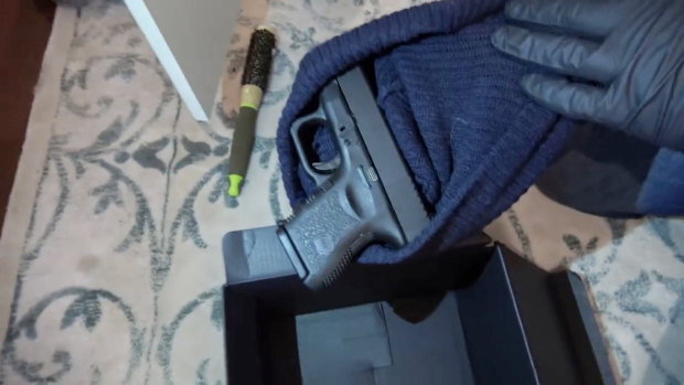 The Glock pistol found inside a black beanie, inside a black box at the bottom of Sarah Budge's wardrobe.