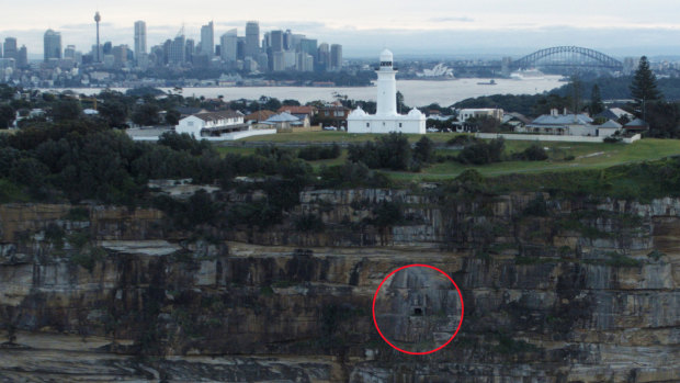 The entrance to the tunnel (circled) below the lighthouse.
