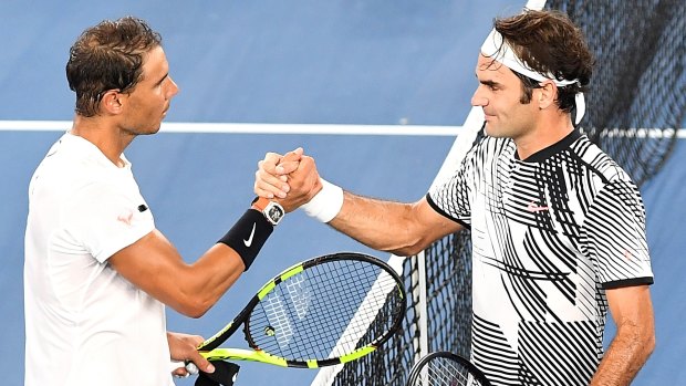 Legends: Nadal congratulates Federer after the epic showdown.