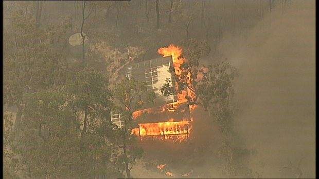 A building burns near the Hawkesbury River on Wednesday.