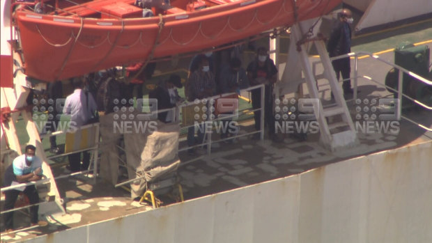 Crew members disembarking the Al Messilah.