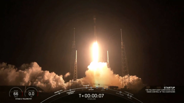 A Falcon 9 rocket lifts off, carrying 60 Starlink satellites into orbit.