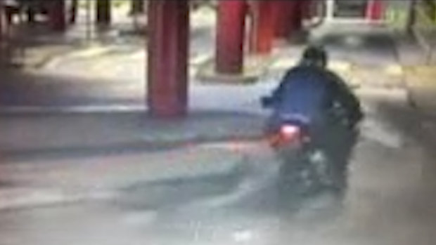 Police are hunting for this motorcyclist who held up a van with a firearm at Waverley Gardens Shopping Centre in Mulgrave.