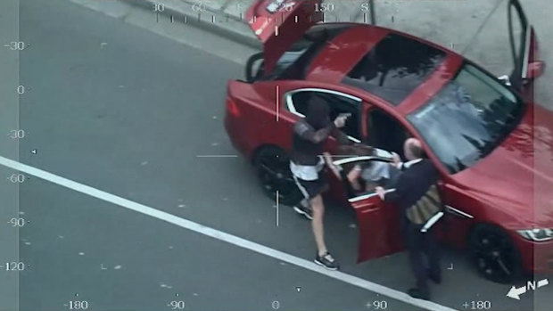 Vision from a police helicopter shows Patrick McMillan carjacking a female driver in Ivanhoe.