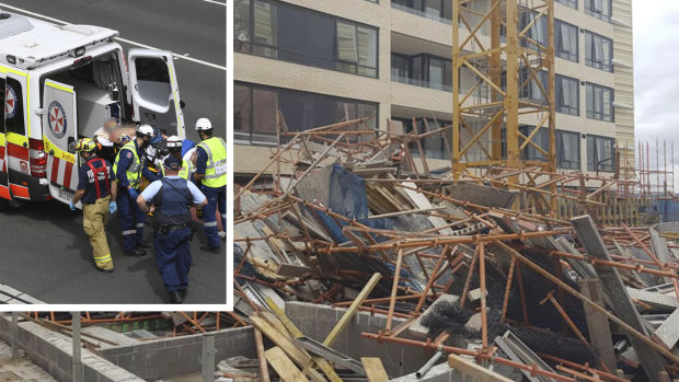 An injured worker is taken away from the accident site in Macquarie Park.