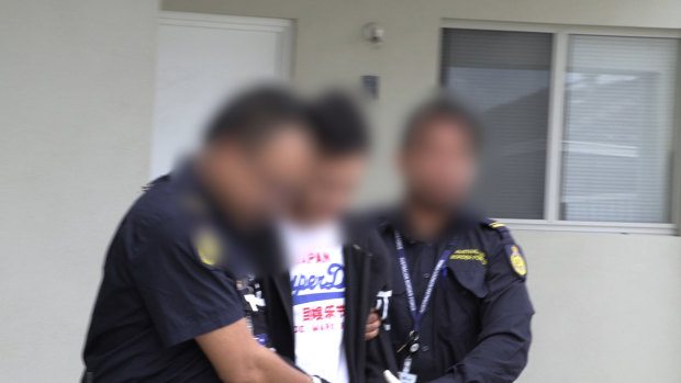 One of the Malaysian men is arrested in Perth.