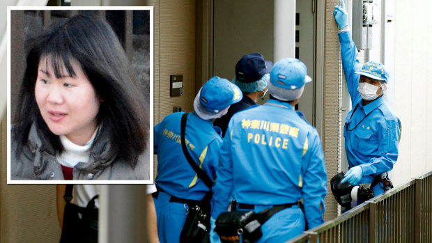 Police investigators head to the house of suspect Ayumi Kuboki in Yokohama.