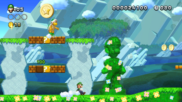 There's a hidden Luigi in every stage. You don't get anything for finding them, they're their own reward.