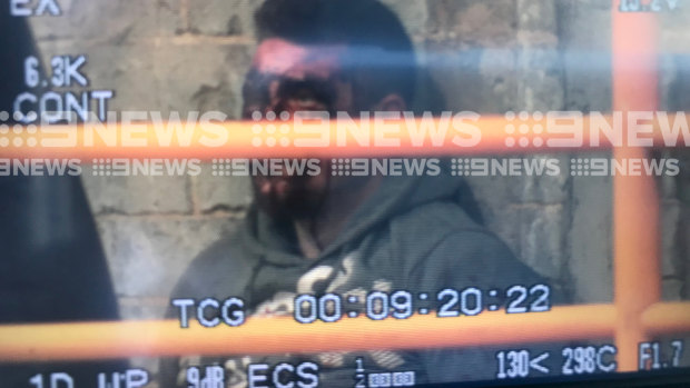 The man, believed to be Jonathan Dick, after the arrest in Hosier Lane.