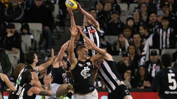 Mark of a champion: Will Hoskin Elliott flies high for the Pies.