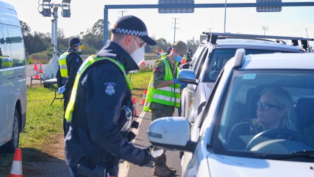 Police at a checkpoint on the Princes Freeway near Little River, just outside Melbourne.