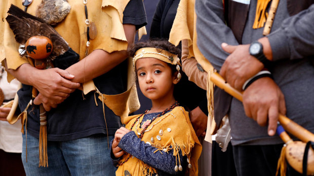 Ellie Morales Recalde, 5, attends a sunrise ceremony in downtown Los Angeles for the first celebration of Indigenous Peoples Day.