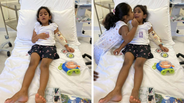 Tharnicaa and her sister Kopika in hospital on Christmas Island on Sunday, June 6.