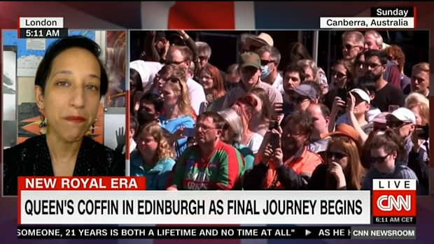 A Rabbitohs fan amongst a crowd of mourners for Queen Elizabeth II.