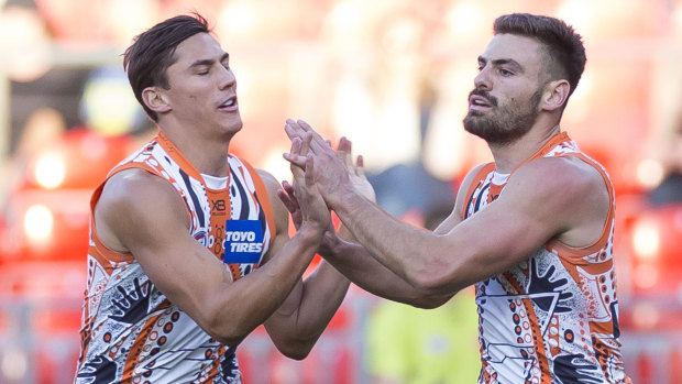 Virtuoso: Stephen Coniglio, right, adds to his tally against the Suns