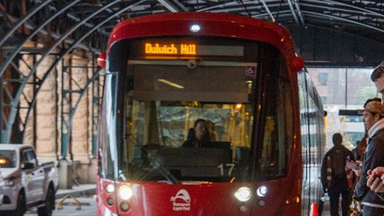 Passengers wait for the Inner West light rail at Central Station pre-COVID.