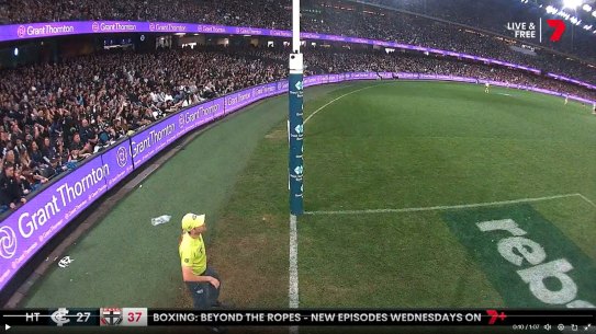 A water bottle is seen being thrown at the goal umpire.
