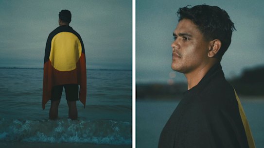 Latrell Mitchell is draped in the Aboriginal flag in the ad.