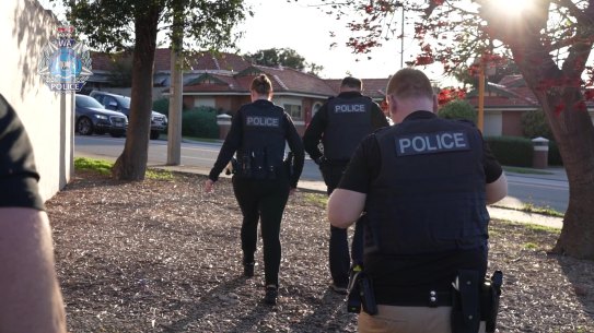Police raid one of the Perth properties.