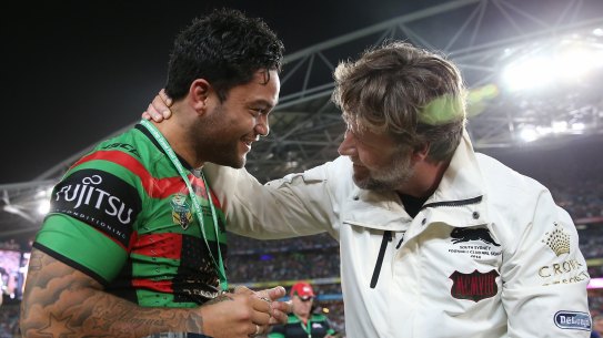 Russell Crowe embraces Issac Luke after the hooker was forced to watch the 2014 grand final from the sidelines due to suspension.