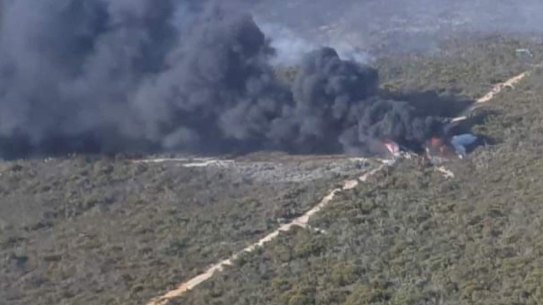 The burning crash site of a Boeing 737-300 firefighting aircraft operated by Coulson Aviation in Western Australia in 2023.