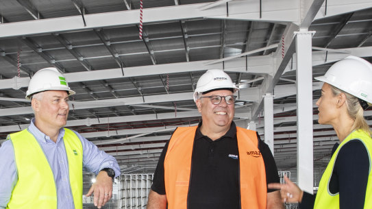  left to right Jason Little GM Goodman Australia, Craig Fuller Amazon Director of Operations and Stephanie Partridge Senior Development Manager from Goodman. Amazon Australia and its first Amazon Robotics fulfilment centre, under construction near Kemps Creek.