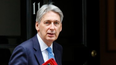 Philip Hammond, UK chancellor of the exchequer, departs number 10 Downing Street on his way to a weekly questions and answers session in Parliament in London, UK. 