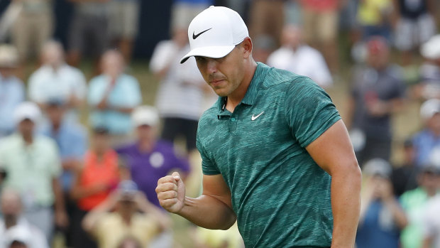 On fire: Brooks Koepka celebrates after making his birdie putt on the 15th hole during the final round of the PGA Championship.