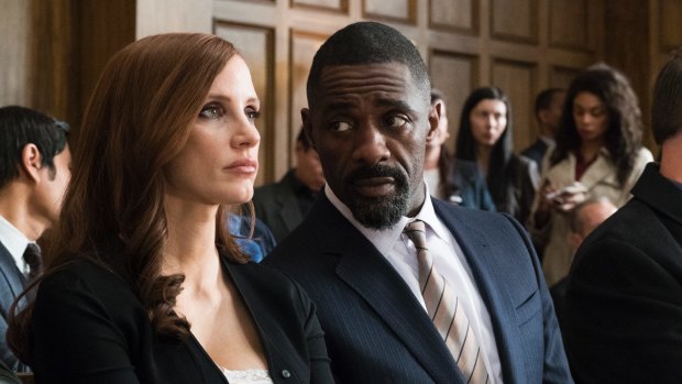 Idris Elba with Jessica Chastain in a scene from 'Molly's Game'.