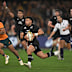 Richie Mo'unga of the All Blacks makes a break to score a try.