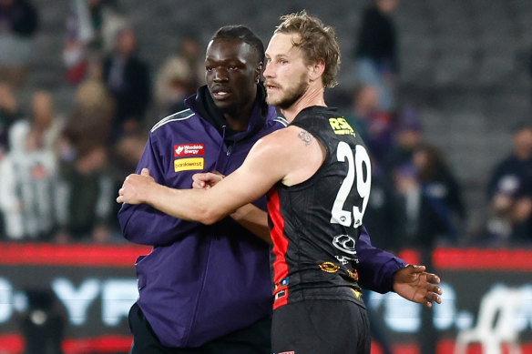 Michael Frederick of the Dockers and Jimmy Webster of the Saints shake hands post game.