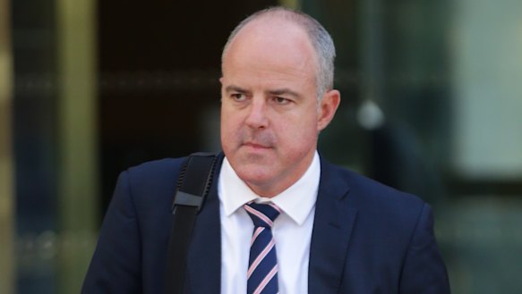 Suncorp executive David Carter leaves the royal commission. 