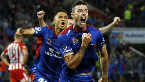 Grand final bound: Jets' Jason Hoffman scores the winner over Melbourne City on Friday night. 