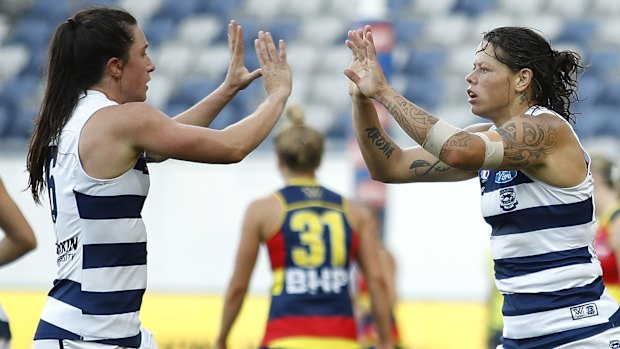 Top Cats: Richelle Cranston celebrates a goal with Julia Crockett-Grills.