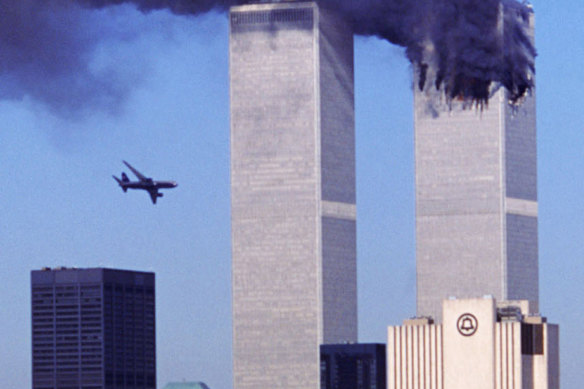 Live apocalypse: As the New York World Trade Centre’s north tower burns, a second hijacked airliner flies towards the south tower on September 11, 2001.