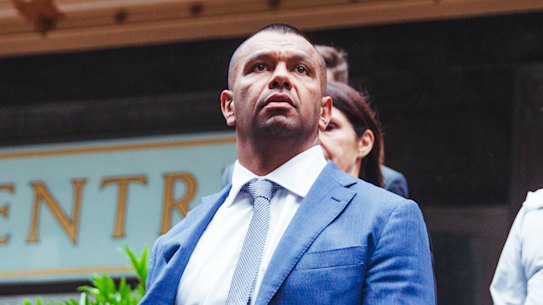 Wallabies star Kurtley Beale with supporters and lawyers outside court on Tuesday.