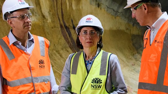 Transport Minister Andrew Constance, Premier Gladys Berejiklian and Transport for NSW Secretary Rodd Staples at the Barangaroo metro construction on Thursday. 
