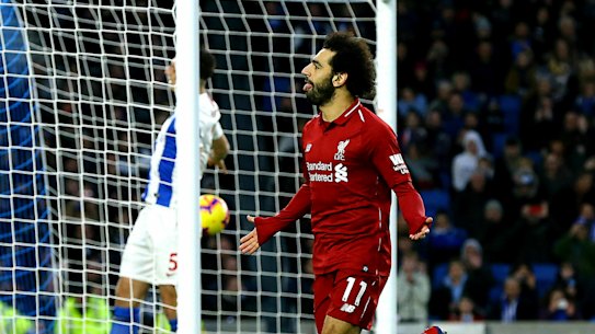 Spot on: Mohamed Salah celebrates after converting the only goal in Liverpool's victory.