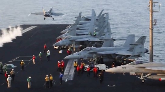 An aircraft takes off from the USS Harry S. Truman in the Red Sea before airstrikes in Sanaa on March 15. 