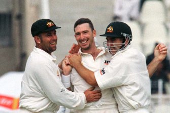 Darren Lehmann and Justin Langer greet Damien Fleming during a Test in 1998. Lehmann and Langer both went on to coach the team.