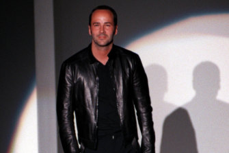 Tom Ford bows to the audience at the end of the Gucci Fall-Winter fashion collection in 1999.