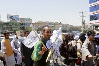 A man sells Taliban flags in Herat province, west of Kabul, Afghanistan, on Saturday.