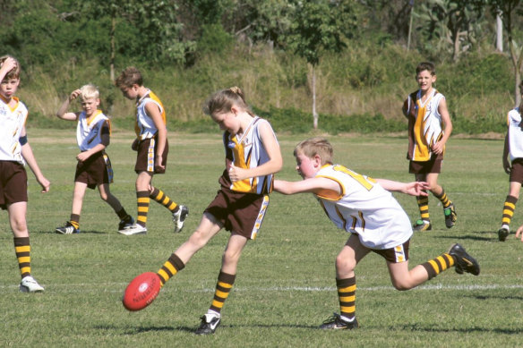 Growing up playing junior football in Queensland with the Aspley Hornets, Harris was the only girl playing in a boys’ league. While many opponents wouldn’t go near her, “some just wanted to smash me more,” she says, “which I preferred.” 