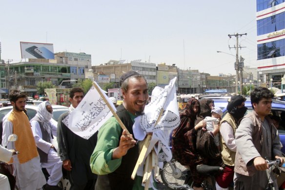 A man sells Taliban flags in Herat province, west of Kabul, Afghanistan, on Saturday.